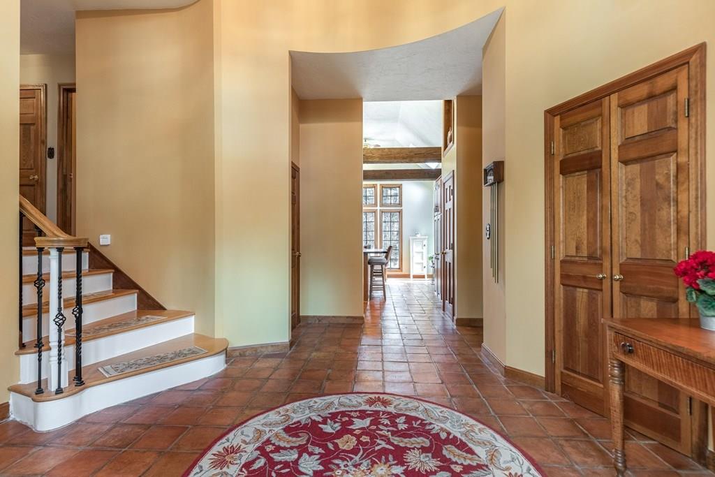 77 Richardson Road Boxborough, MA 01719 - Photo 14 of 32 a view of a hallway with wooden floor and staircase