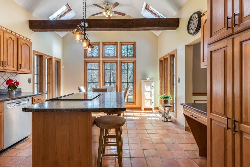 77 Richardson Road Boxborough, MA 01719 - Photo 2 of 32 a kitchen with stainless steel appliances a sink and a refrigerator