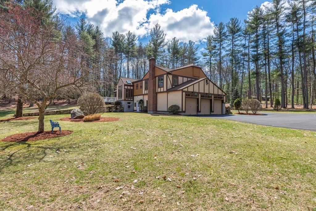 77 Richardson Road Boxborough, MA 01719 - Photo 25 of 32 a front view of a house with a yard