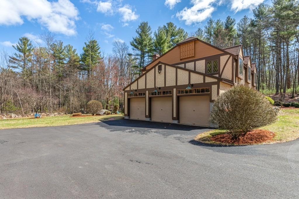 77 Richardson Road Boxborough, MA 01719 - Photo 27 of 32 a house that has a small yard and a large pool