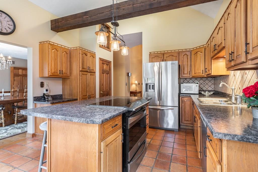 77 Richardson Road Boxborough, MA 01719 - Photo 6 of 32 a kitchen with stainless steel appliances granite countertop a sink and a refrigerator