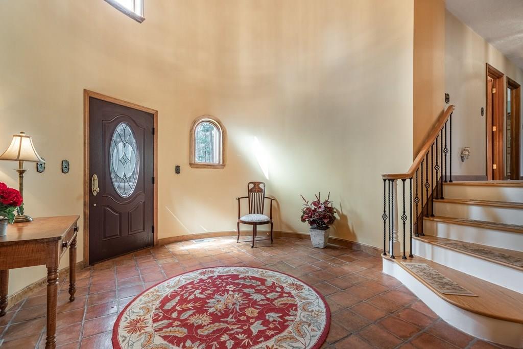 77 Richardson Road Boxborough, MA 01719 - Photo 8 of 32 a bed room with a bed and a chandelier