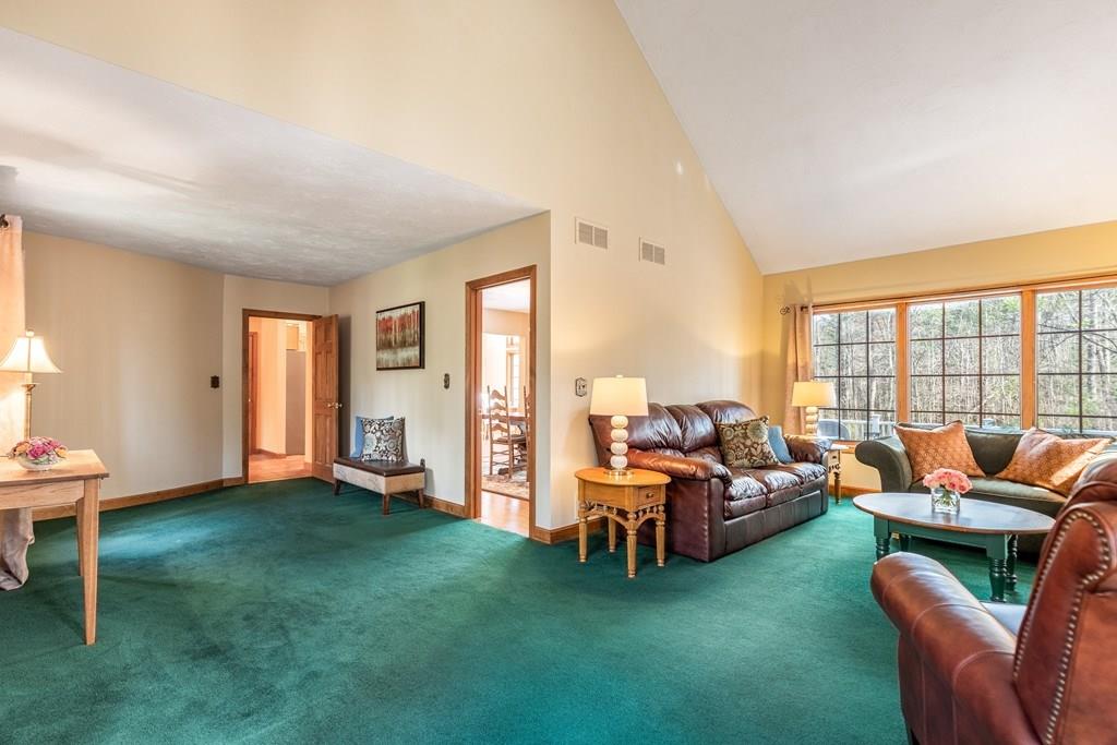 77 Richardson Road Boxborough, MA 01719 - Photo 10 of 32 a living room with furniture and a fireplace