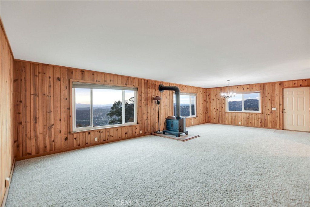 6750 Rainbow Heights Road Fallbrook, CA 92028 - Photo 11 of 64 an empty room with furniture and a large window