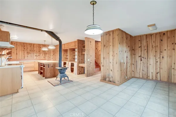 a kitchen with stainless steel appliances granite countertop a stove and a sink