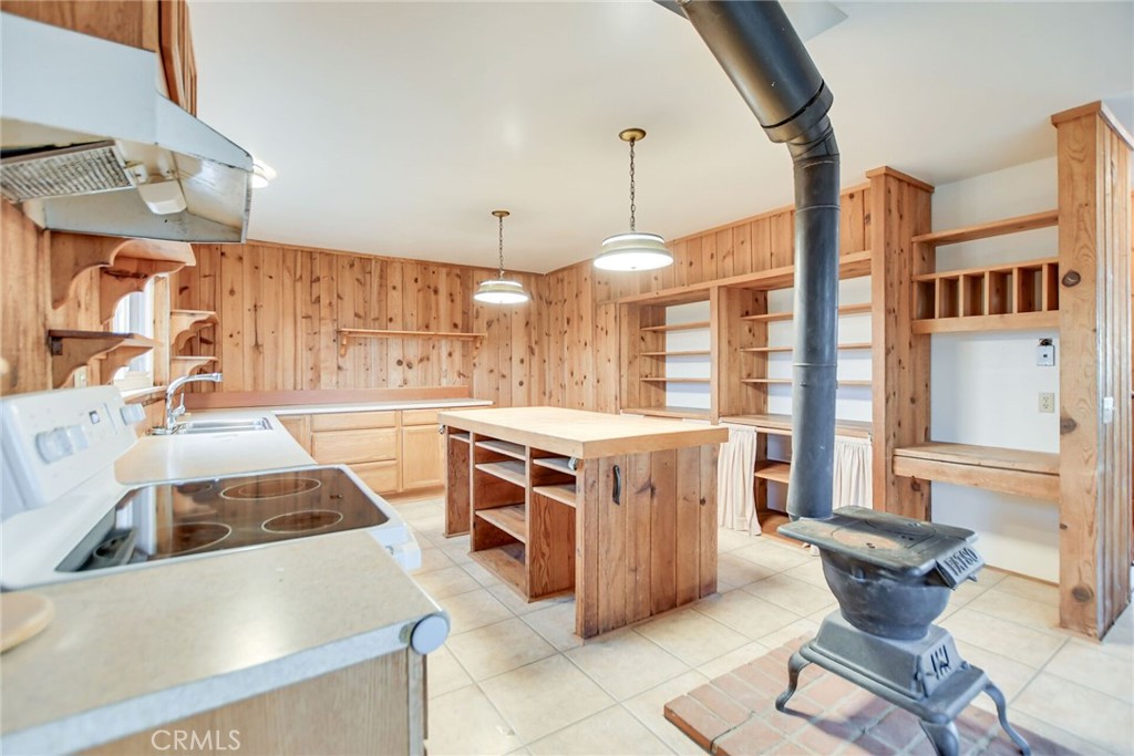 6750 Rainbow Heights Road Fallbrook, CA 92028 - Photo 19 of 64 a kitchen with stainless steel appliances granite countertop a stove and a sink