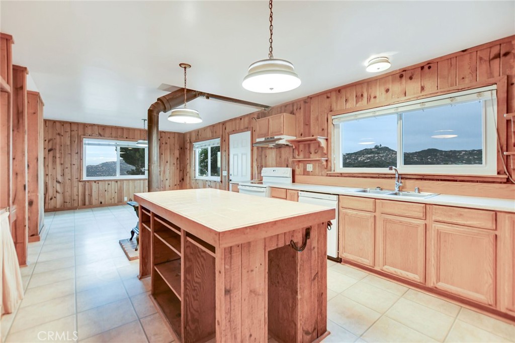 6750 Rainbow Heights Road Fallbrook, CA 92028 - Photo 20 of 64 a kitchen with a stove and a sink