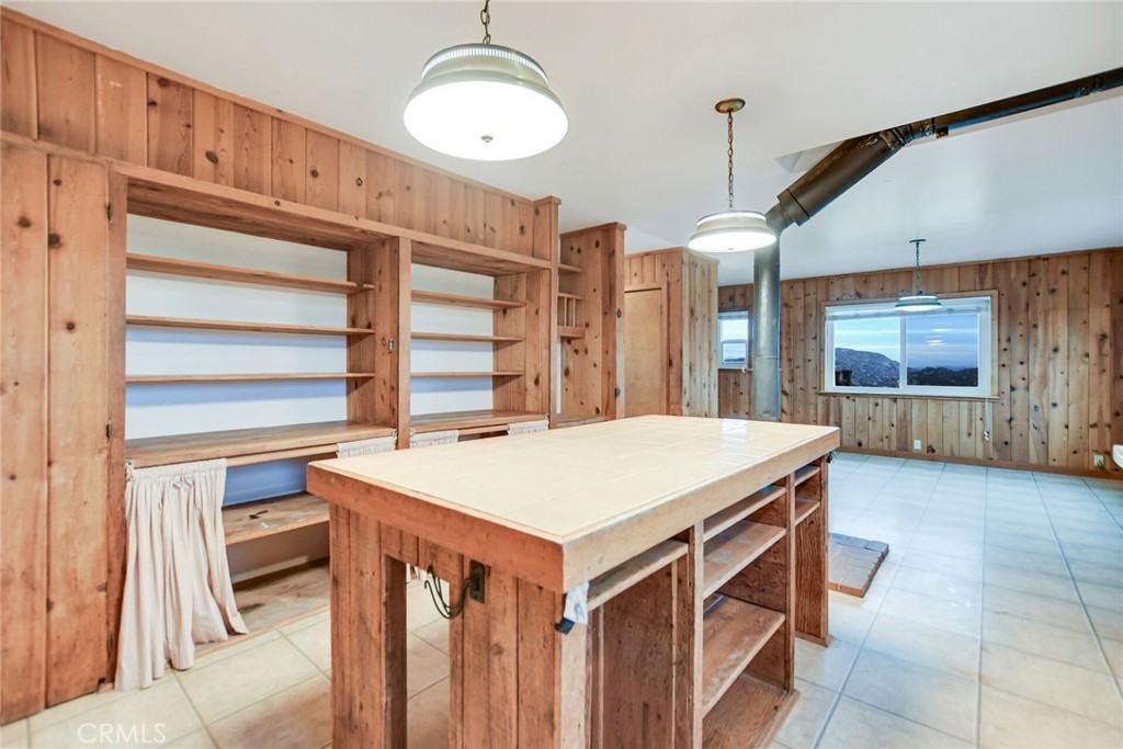 6750 Rainbow Heights Road Fallbrook, CA 92028 - Photo 21 of 64 a kitchen that has a lot of cabinets in it