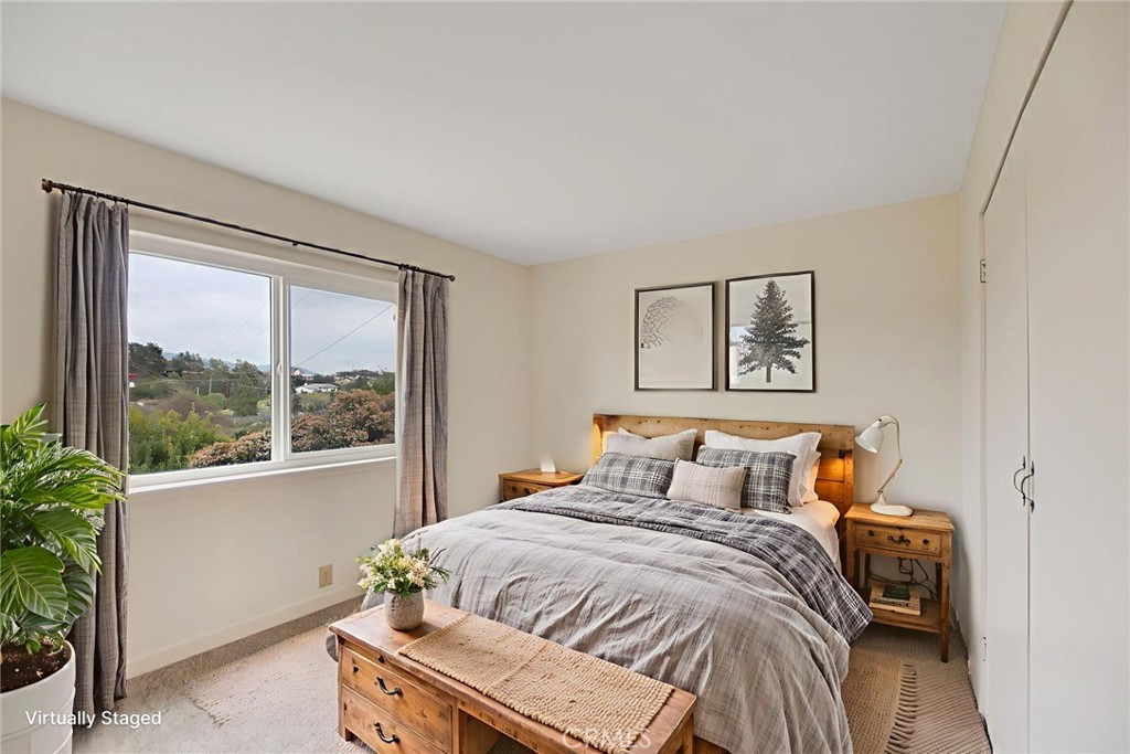 6750 Rainbow Heights Road Fallbrook, CA 92028 - Photo 22 of 64 a bedroom with a bed and a large window