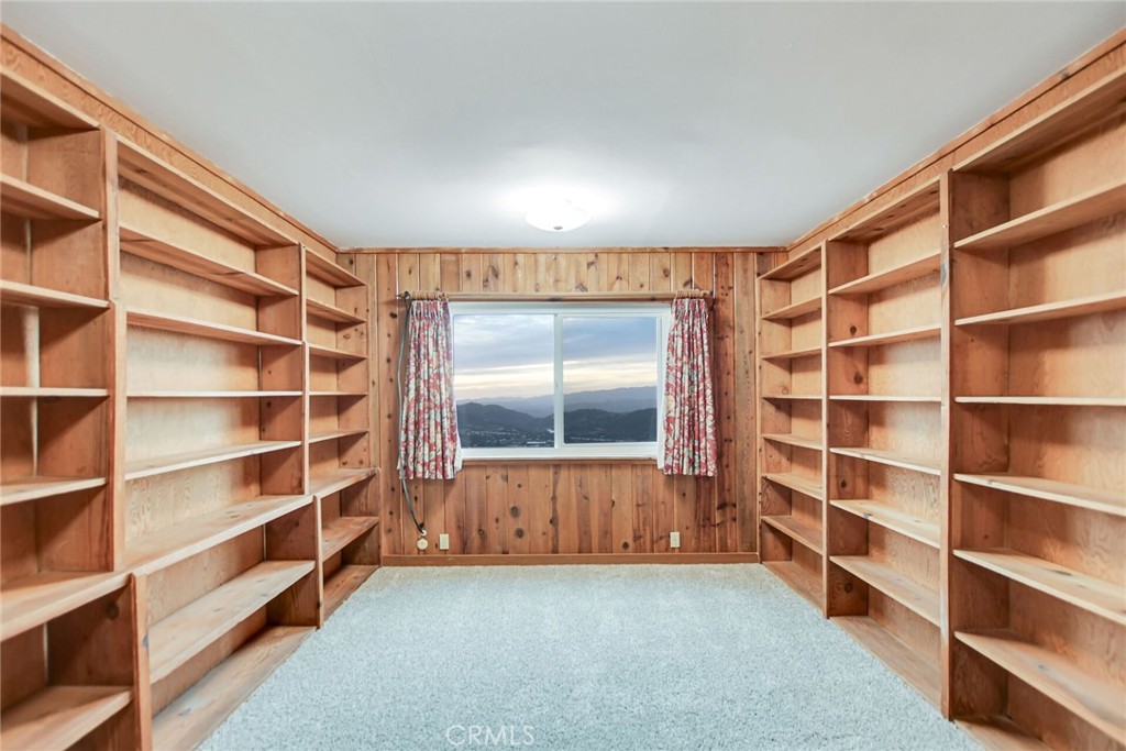 6750 Rainbow Heights Road Fallbrook, CA 92028 - Photo 25 of 64 a view of an empty room with a window and wooden floor