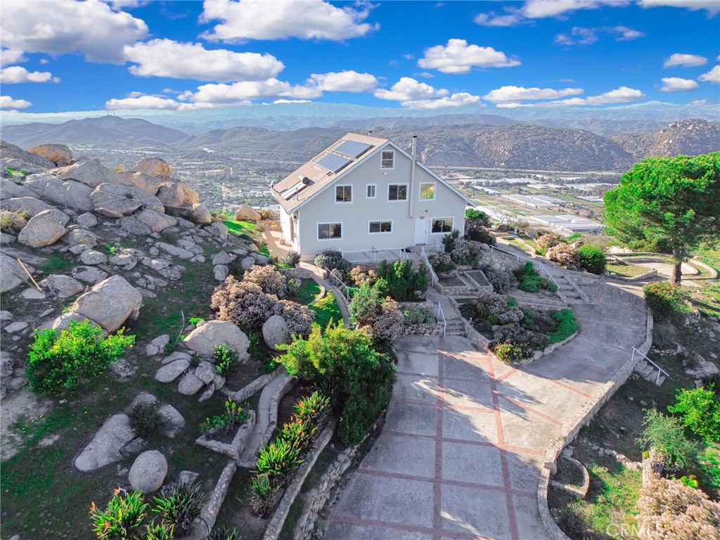 6750 Rainbow Heights Road Fallbrook, CA 92028 - Photo 3 of 64 a view of a house with a yard