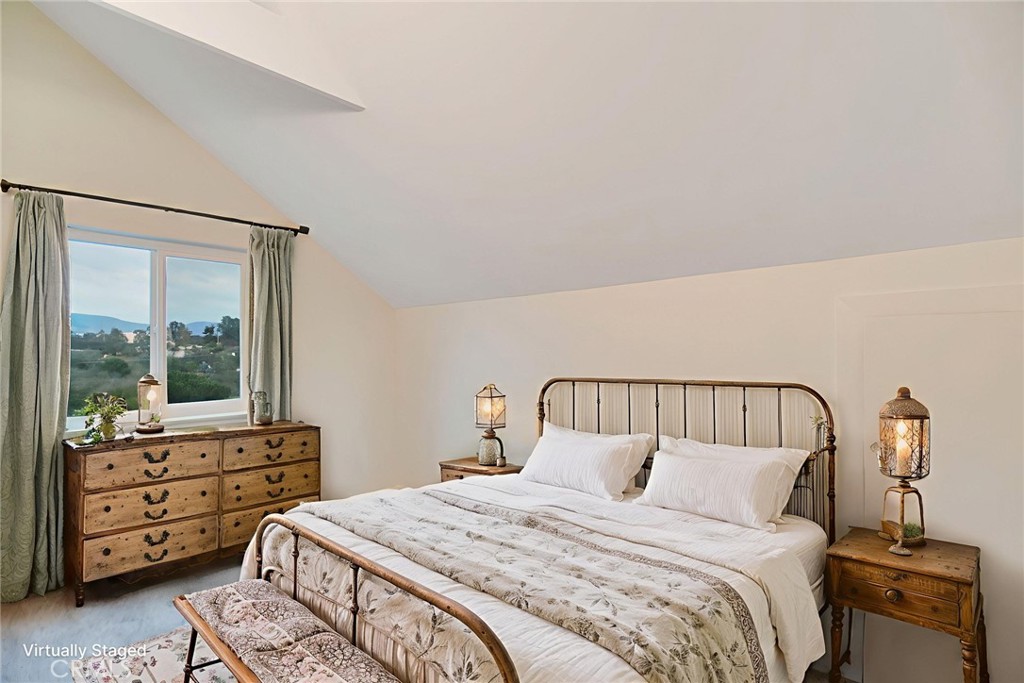 6750 Rainbow Heights Road Fallbrook, CA 92028 - Photo 34 of 64 a bedroom with a bed and wooden floor