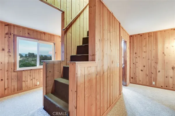 a view of a balcony with wooden floor