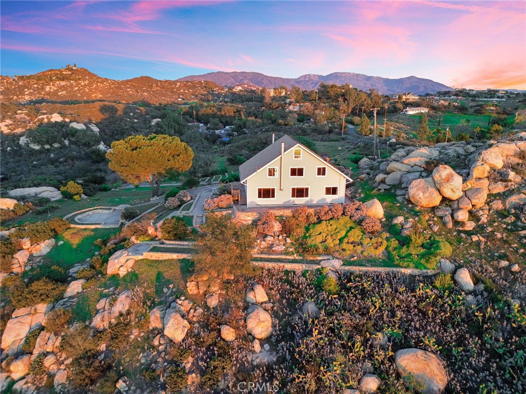 6750 Rainbow Heights Road Fallbrook, CA 92028 - Photo 64 of 64 a view of a house with a yard and a large window