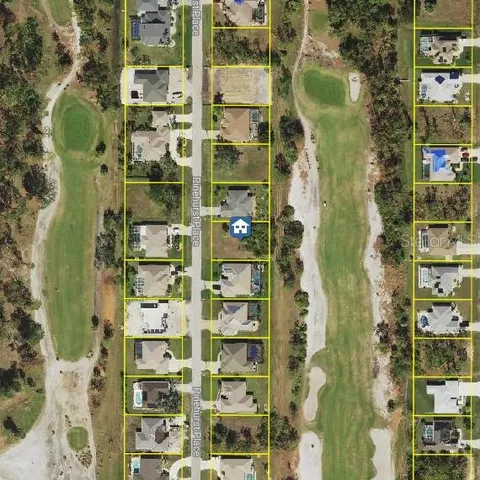 an aerial view of a house with outdoor space