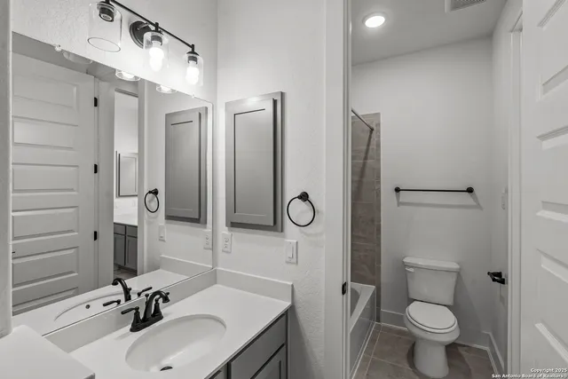 an empty room with wooden floor and window