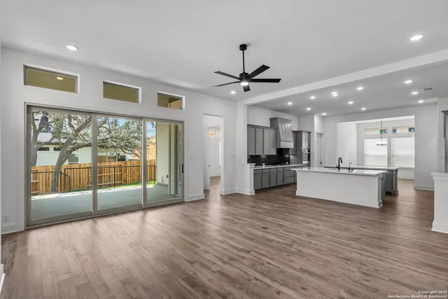a view of kitchen with stainless steel appliances refrigerator microwave and stove
