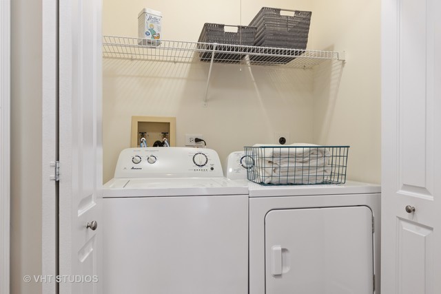 115 Kensington Circle, Unit 108 Wheaton, IL 60189 - Photo 10 of 14 a utility room with dryer and washer