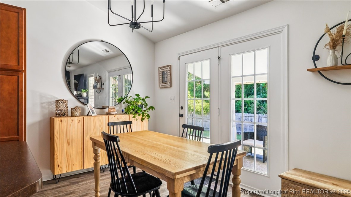 230 Michael Drive Raeford, NC 28376 - Photo 11 of 43 a view of a dining room with furniture window and wooden floor
