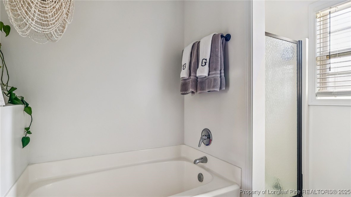 230 Michael Drive Raeford, NC 28376 - Photo 22 of 43 a bathroom with a bathtub
