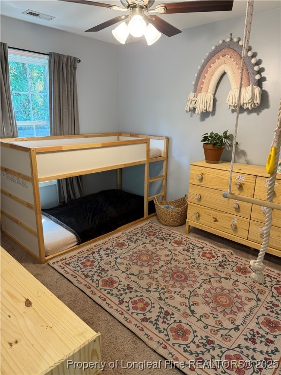 230 Michael Drive Raeford, NC 28376 - Photo 23 of 43 a bed sitting in a room next to a window