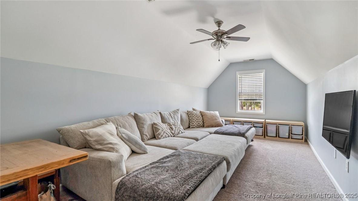 230 Michael Drive Raeford, NC 28376 - Photo 28 of 43 a living room with furniture and a flat screen tv