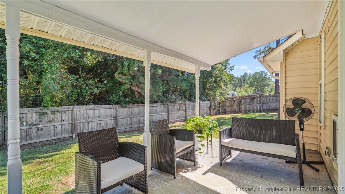 230 Michael Drive Raeford, NC 28376 - Photo 30 of 43 a view of a chairs and table in the patio