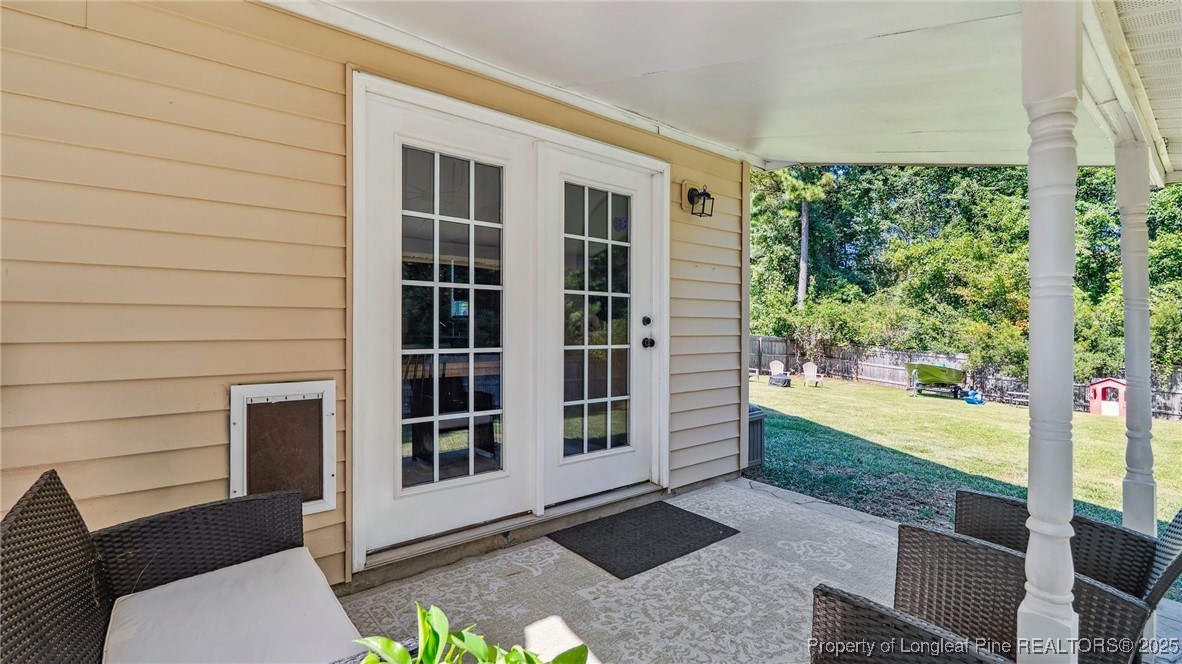230 Michael Drive Raeford, NC 28376 - Photo 31 of 43 a view of a porch with chairs and a yard