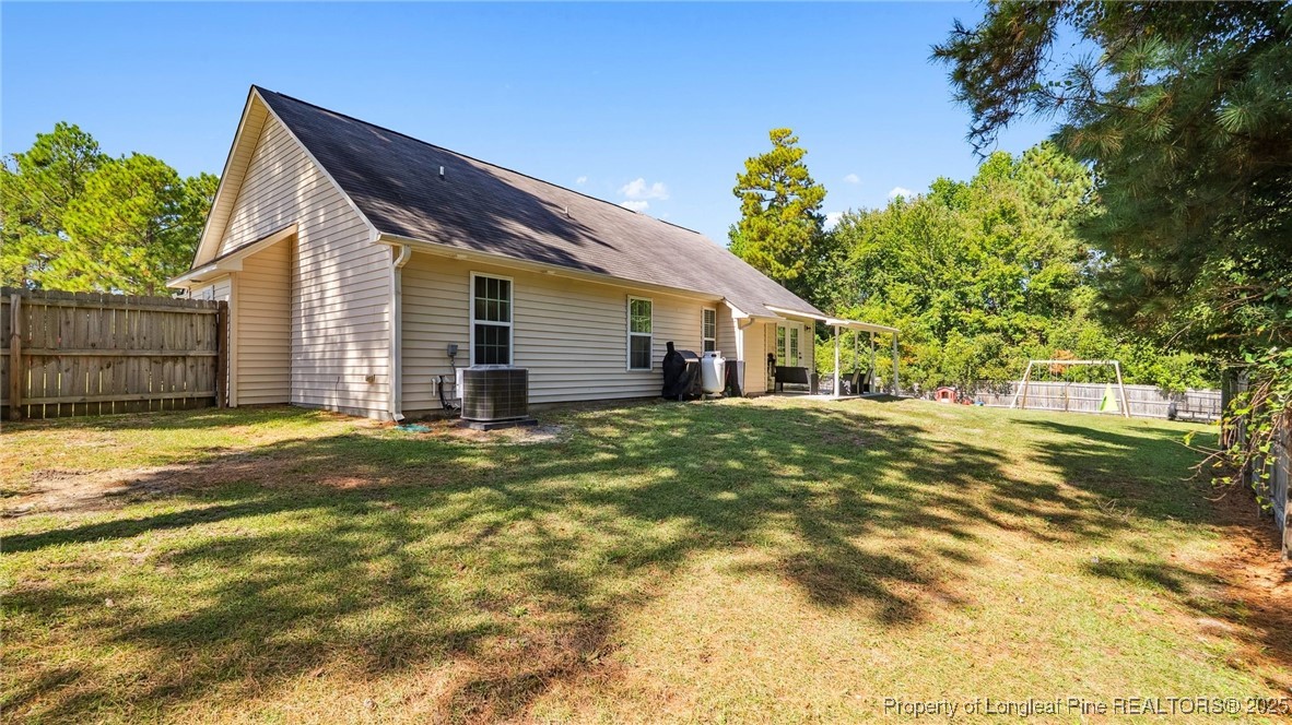 230 Michael Drive Raeford, NC 28376 - Photo 33 of 43 a view of a house with a small yard and a large tree