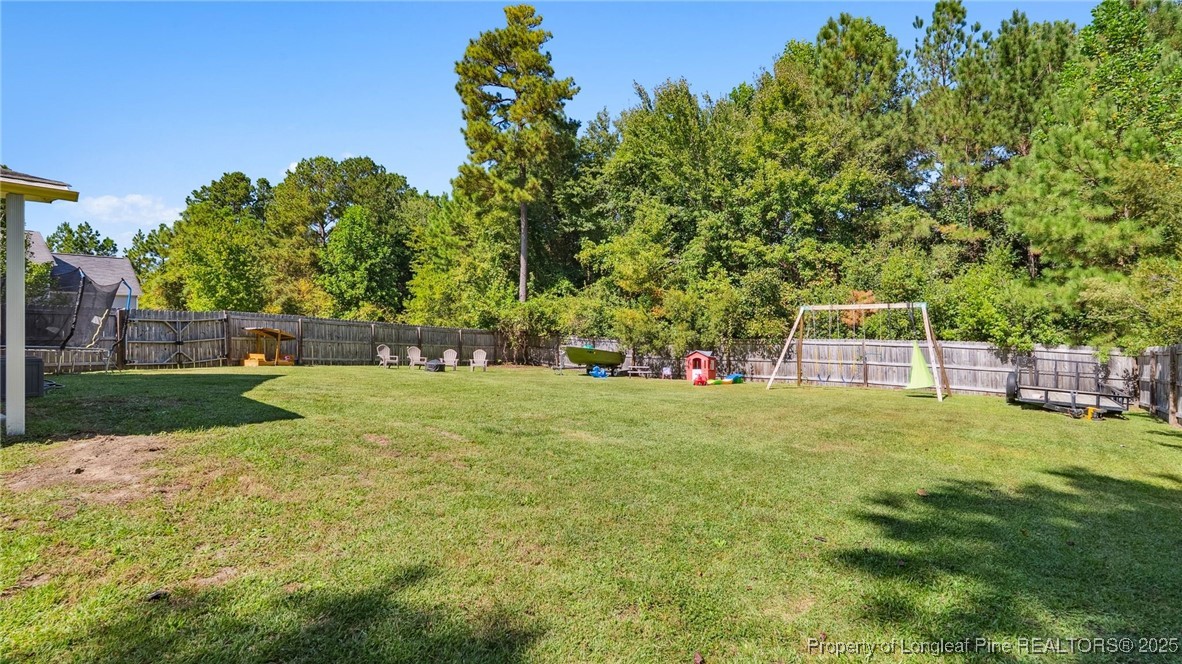 230 Michael Drive Raeford, NC 28376 - Photo 35 of 43 a view of a garden with a house in the background