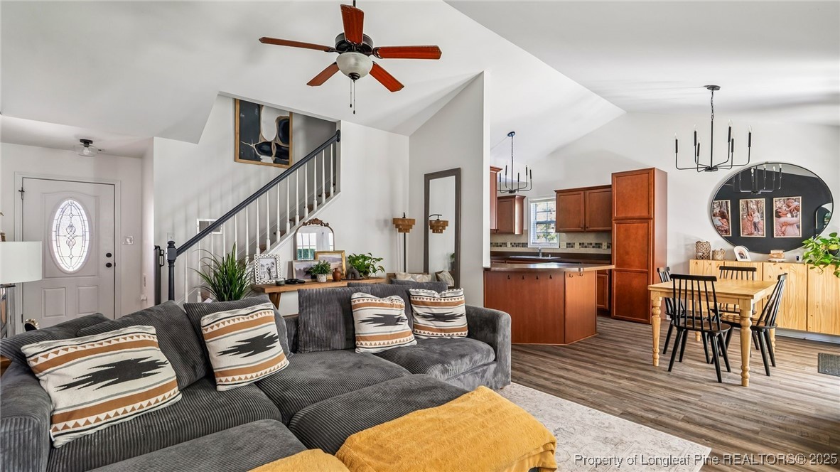 230 Michael Drive Raeford, NC 28376 - Photo 10 of 43 a living room with furniture a rug and kitchen view