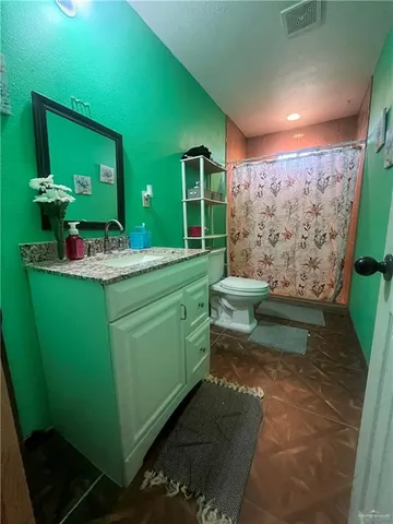 a room with sink furniture and a large window