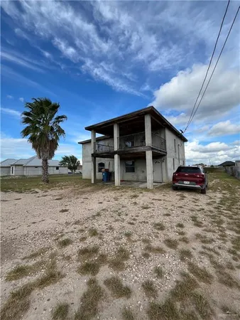 a view of a car parked in front of house