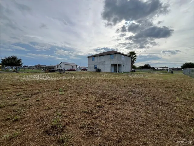 a view of a large body of water with a building in the background