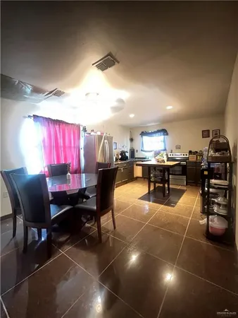 a room with lots of furniture and a table