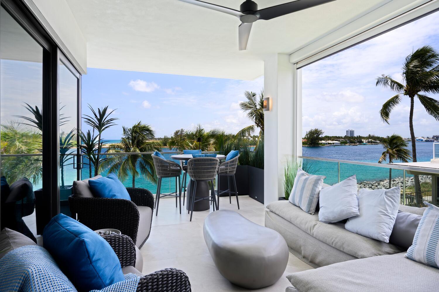 206 Inlet Way, Unit 2W Palm Beach Shores, FL 33404 - Photo 25 of 53 a living room with furniture and a large window