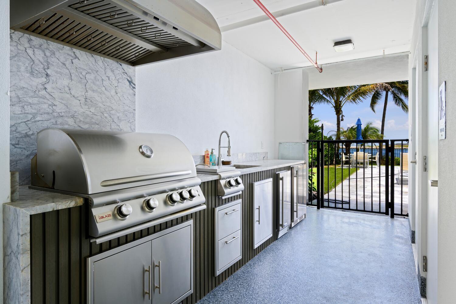 206 Inlet Way, Unit 2W Palm Beach Shores, FL 33404 - Photo 39 of 53 a kitchen with a stove and a shower