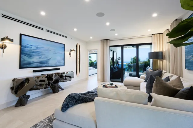 a living room with furniture gym equipment and a large window