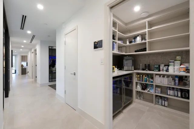 a view of an empty room with shelves