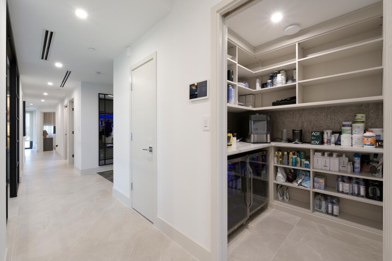 206 Inlet Way, Unit 2W Palm Beach Shores, FL 33404 - Photo 8 of 53 a view of an empty room with shelves