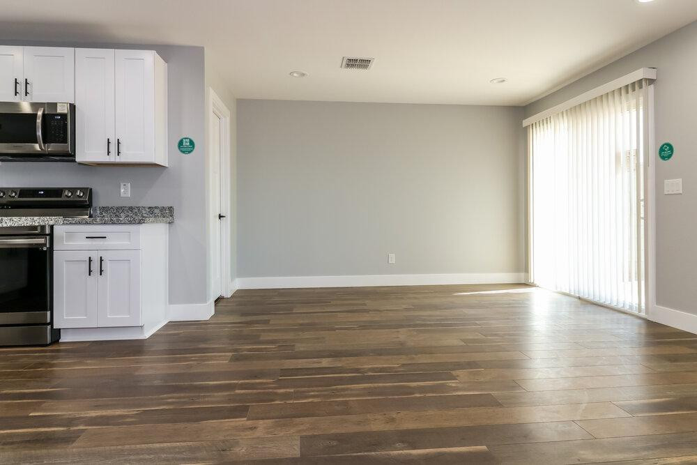 3865 West Gaby Road Phoenix, AZ 85041 - Photo 6 of 16 a view of a kitchen with stove and microwave