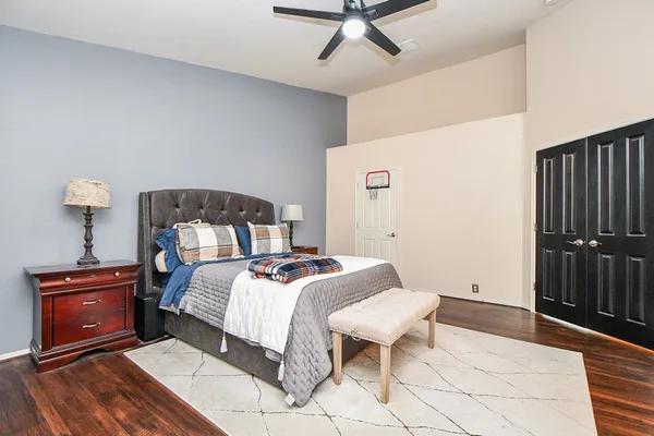 a bedroom with a bed and a table in it