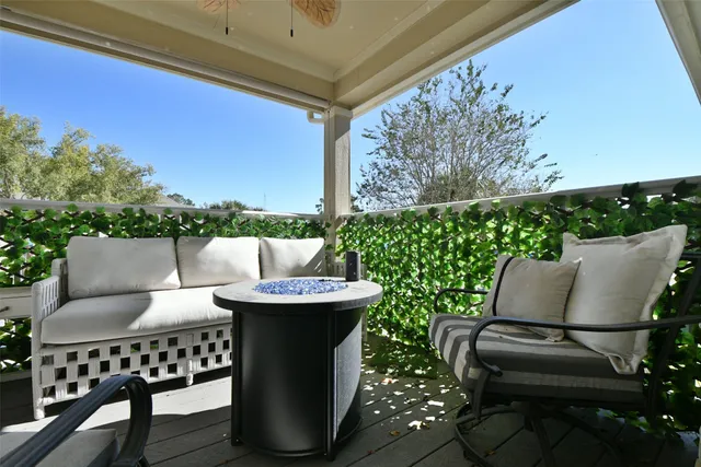 a view of a patio with couches chairs and a potted plant