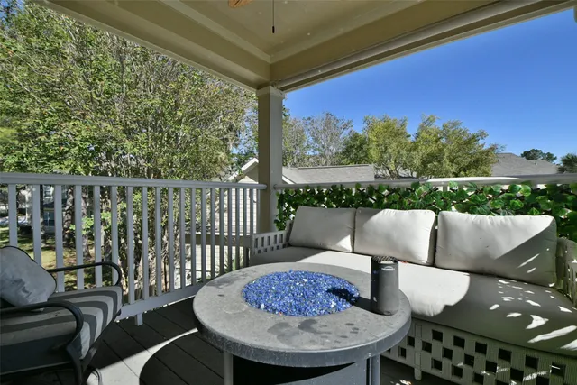 a view of a chairs and table in patio