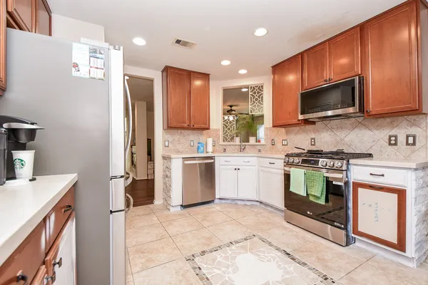 a kitchen with a sink stove and microwave