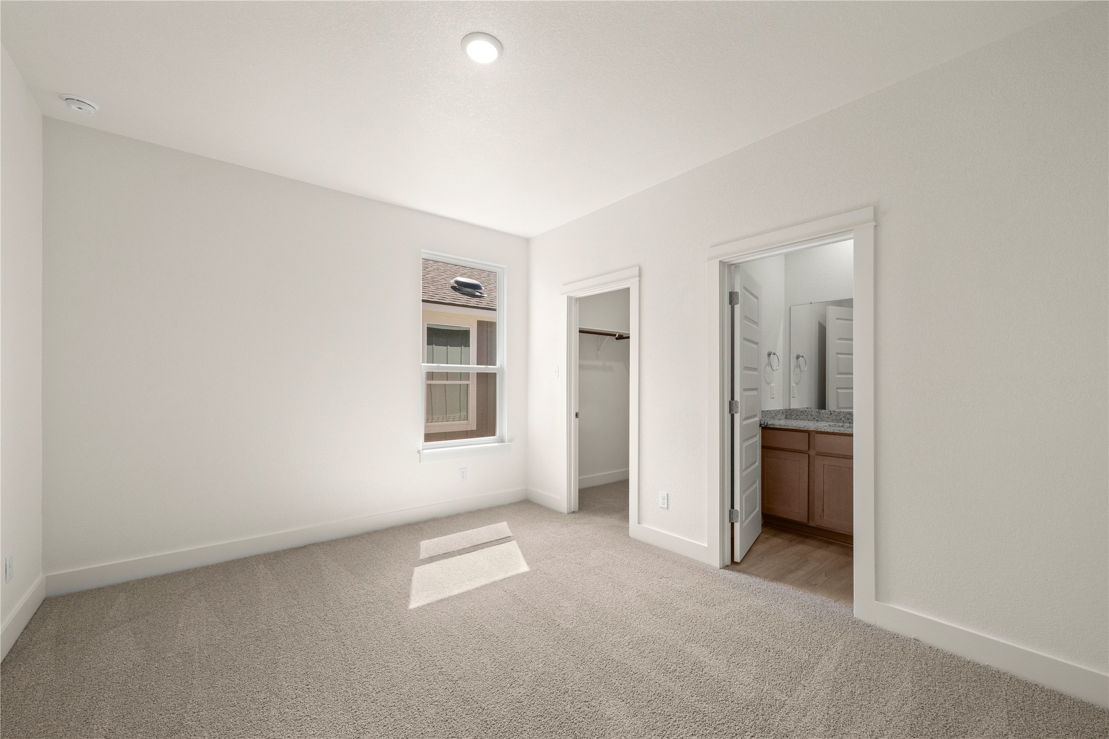544 Gus Loop Georgetown, TX 78626 - Photo 17 of 22 an empty room with windows and closet