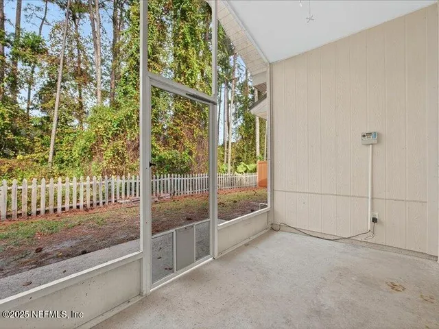 a view of a yard with large trees