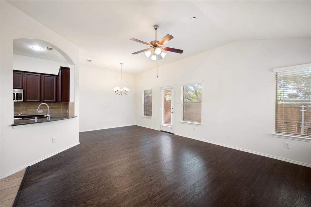 1013 Lucy Lane Allen, TX 75013 - Photo 6 of 30 a view of an empty room with window and wooden floor
