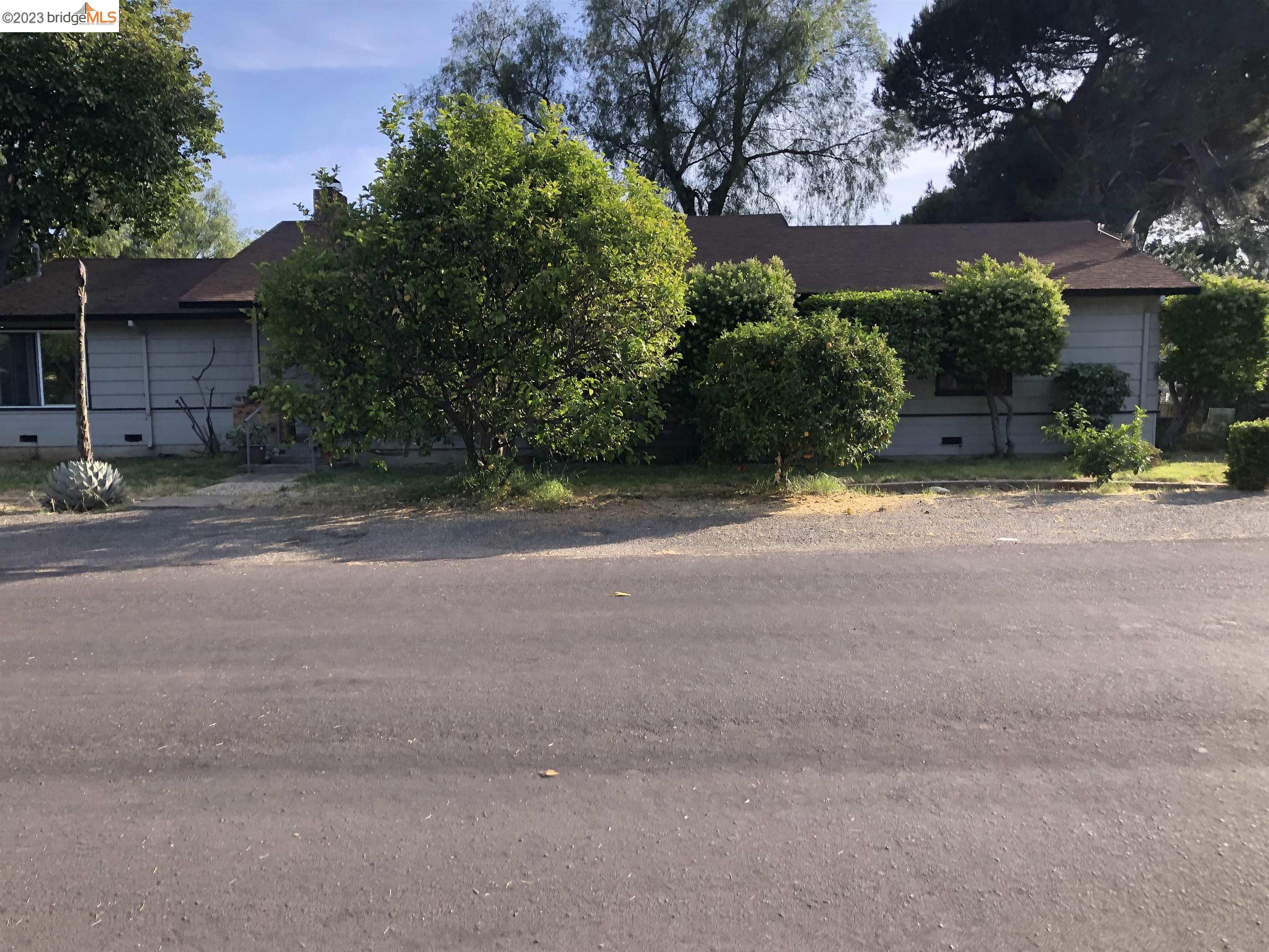 a view of a house with a street