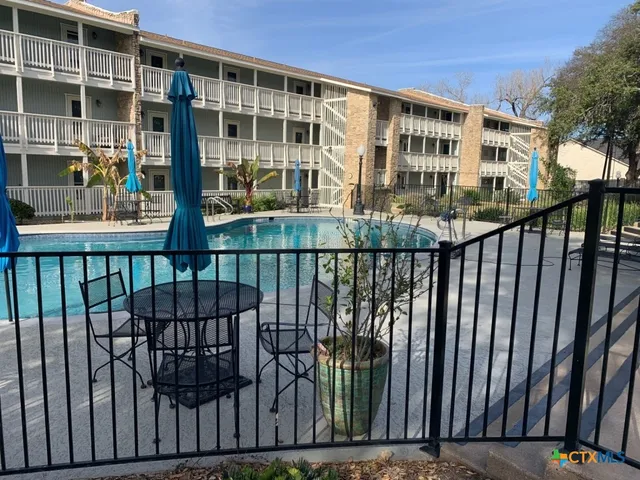 a view of a large building from a balcony